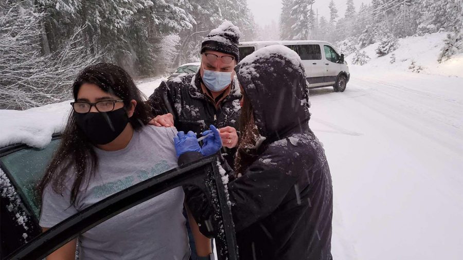 This is an image of someone getting the vaccine on the Oregon roadside.