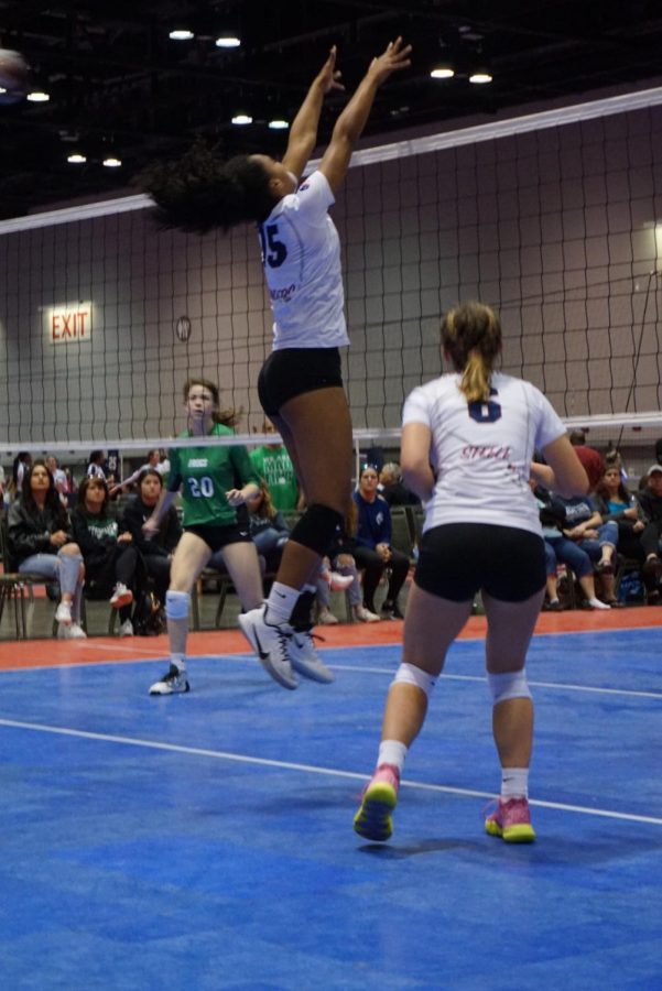 Sanders putting up a solid block during a match.