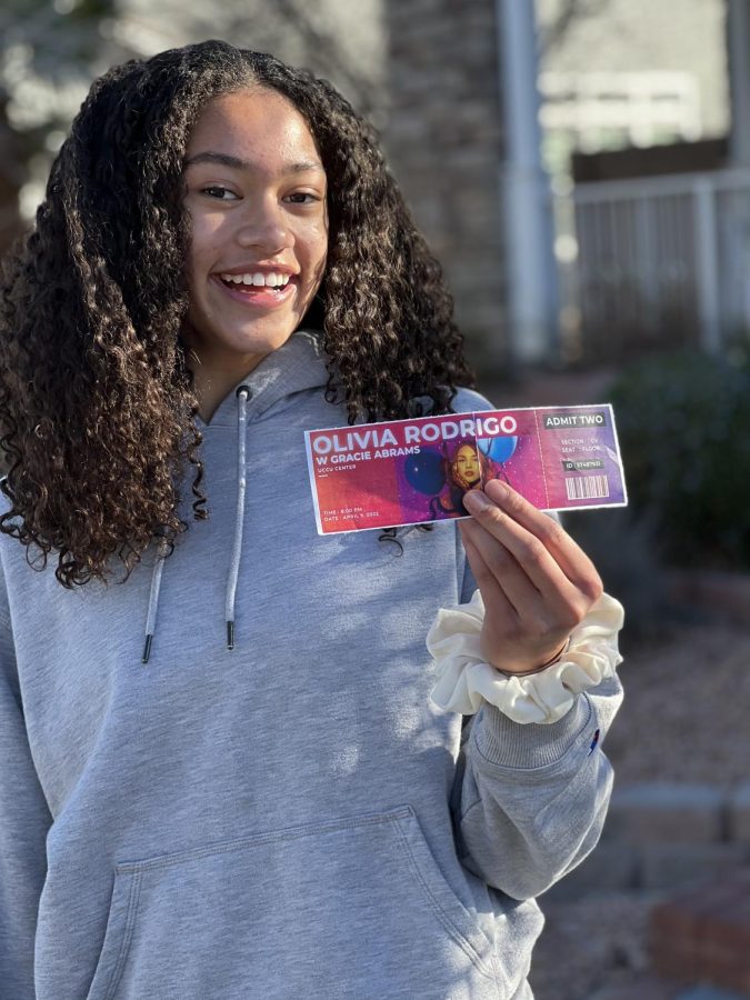 Freshman, Leimaile Lasike, holding her SOUR ticket