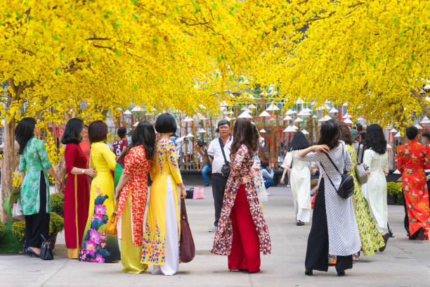 Ao dai, a traditional Vietnamese clothing item, is worn on Lunar New Year