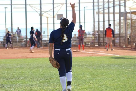 Mikayla Brown calling plays in the outfield