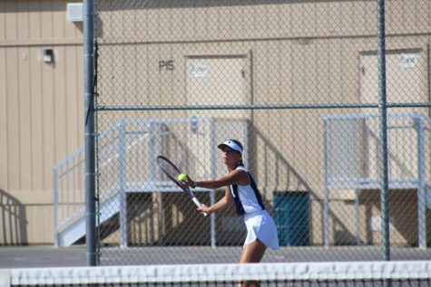 Sophomore Ava Stosich, playing in a tennis match. (Courtesy of: Carlee Stuart)