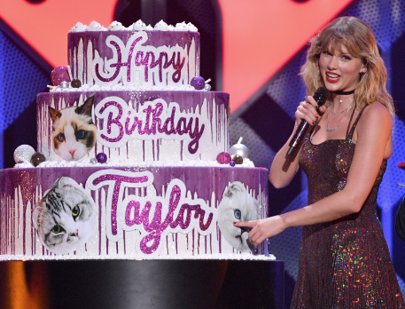 Swift celebrating her 30th birthday with a giant cake