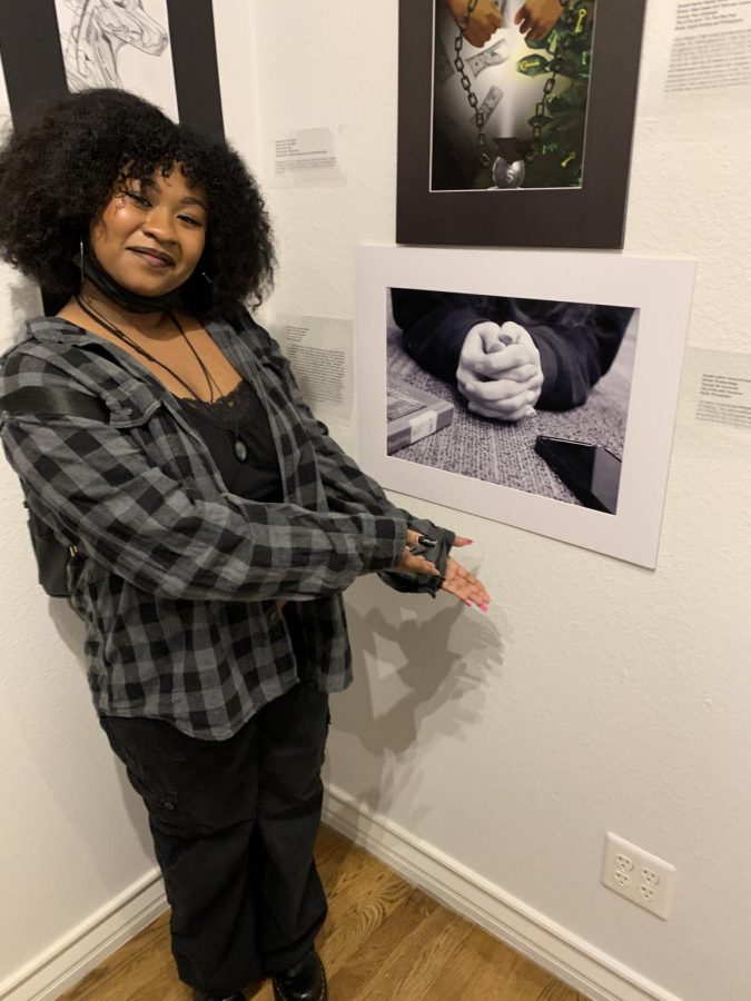 Nadiya Simmons showing off their artwork. 