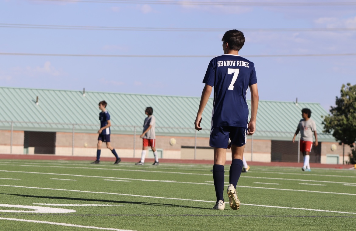 A Shadow player preparing to score.