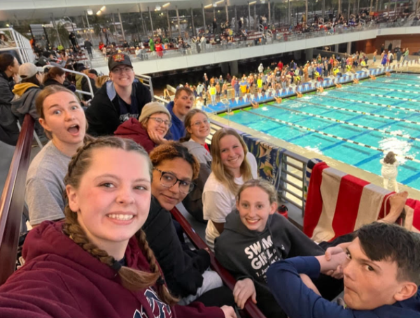 Custer and swim friends at a meet, Photo Courtesy of; Conner Custer
