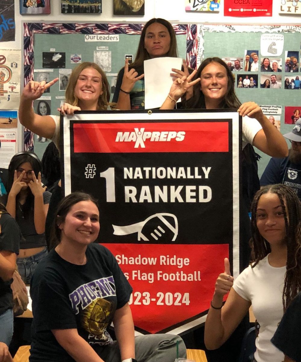 Members of the Shadow Ridge flag football program celebrating the accomplishment