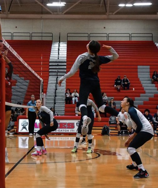 Elaina Smith attacking the ball during a game against Arbor View.