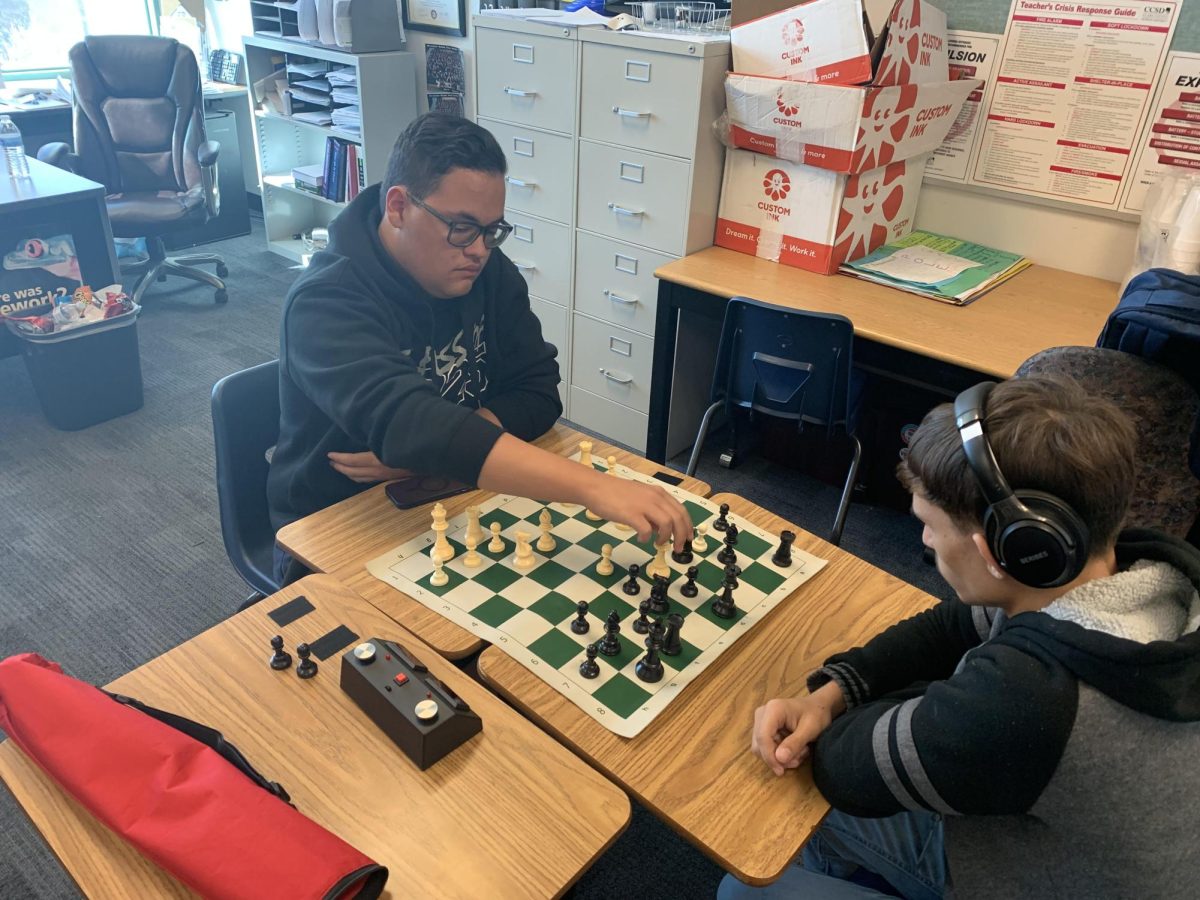 Alex Wilson faces his opponent in chess.