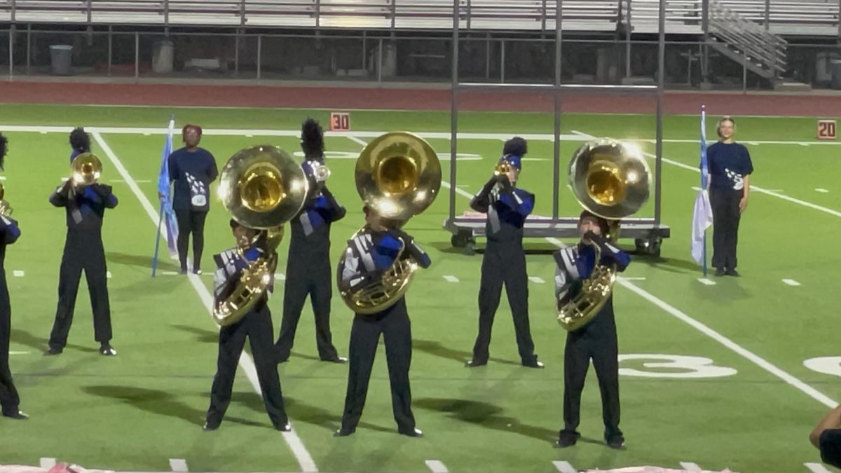 Mayrin Abonce and her fellow tuba players on the football field.