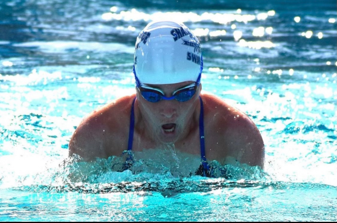 Isis Gwin swimming at a meet