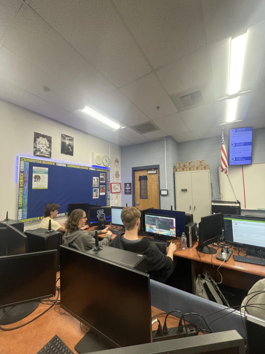 Cyber security students working diligently