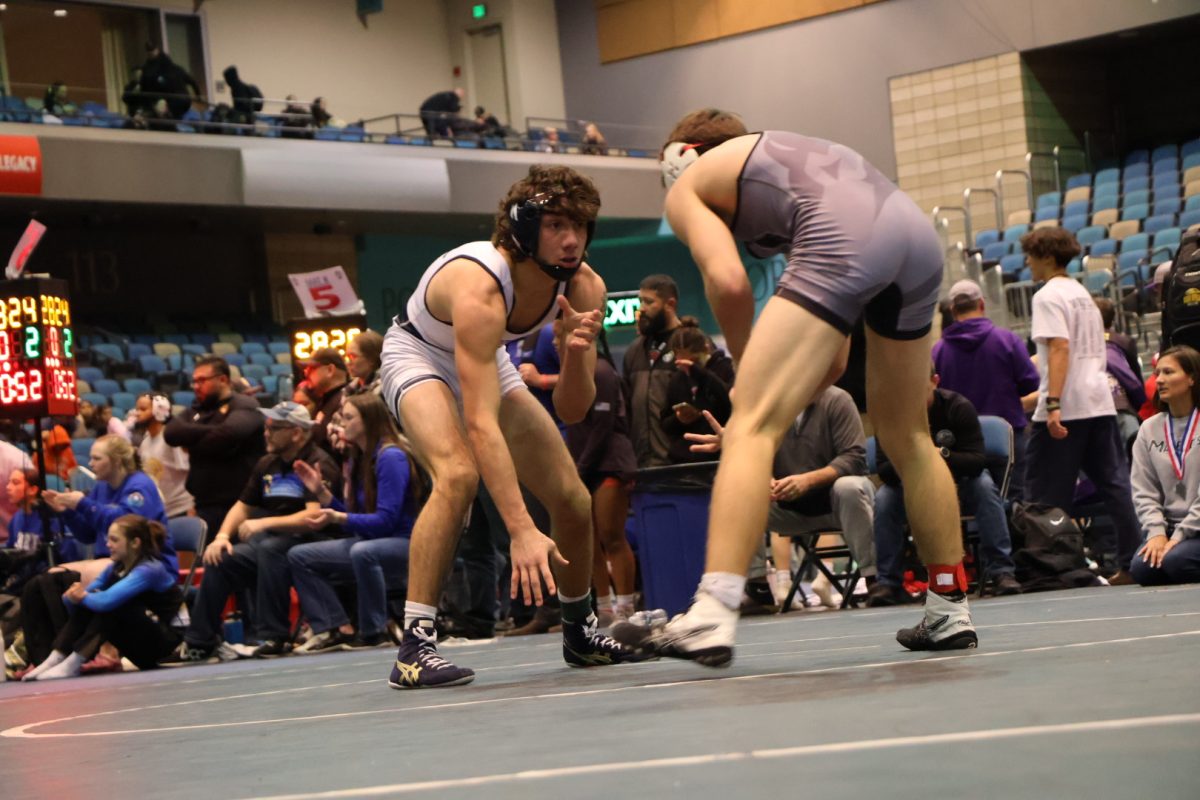 Zuniga at the beginning of a wrestling match, getting ready to win.