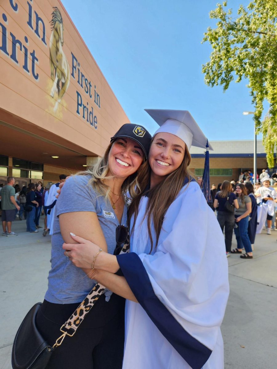 Olivia DeNofa with her mom at grad walk