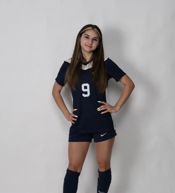 Jordan Dingman showing off her new jersey, as she commits to Graceland University to play soccer and major in psychology.