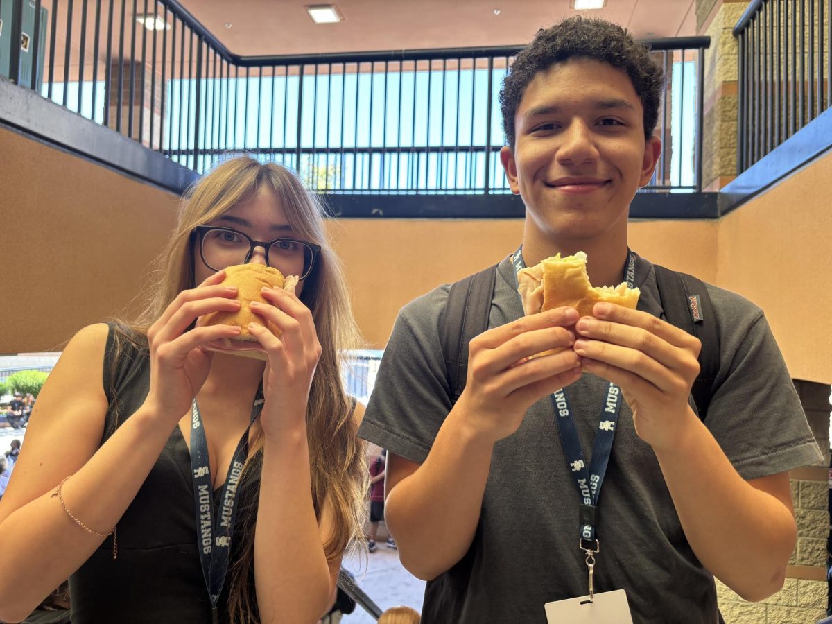 Jadyn Laskowski and Louis Gervasio with Port of Sub sandwiches.