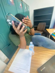 Embarrassed student after being caught on her phone