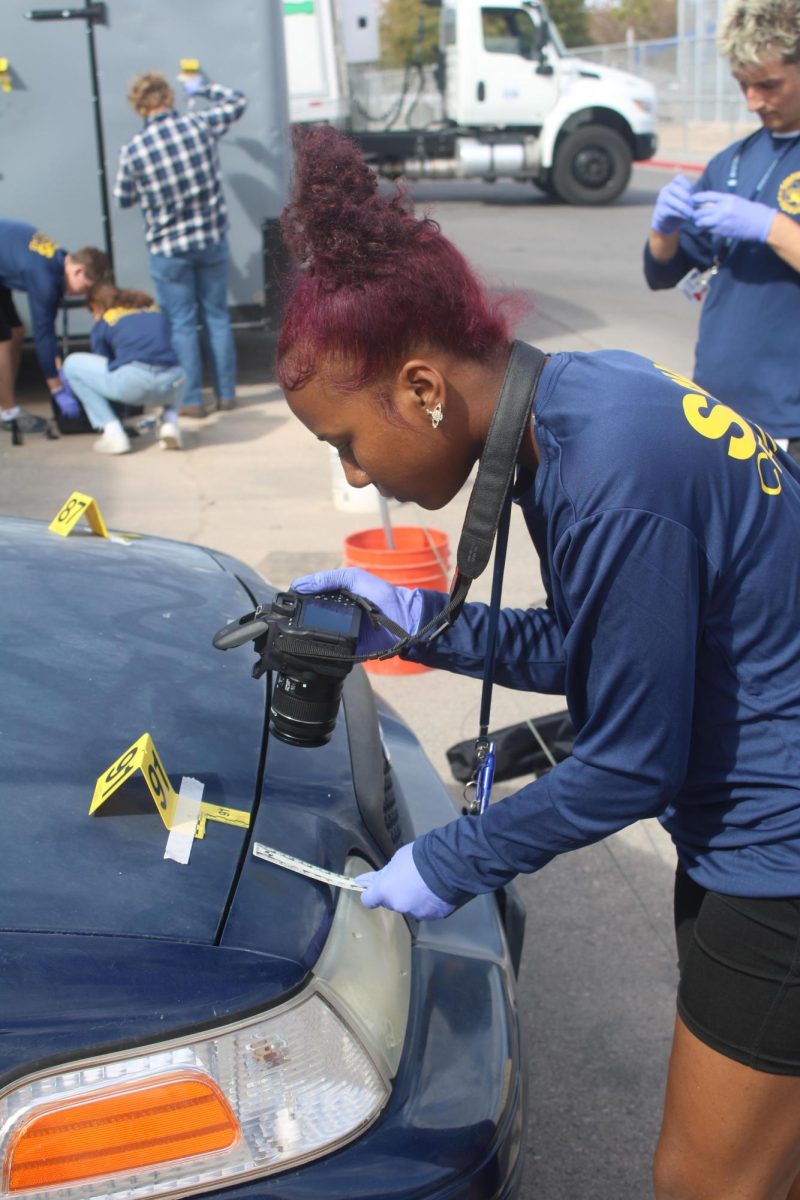 A forensic science student with a camera.