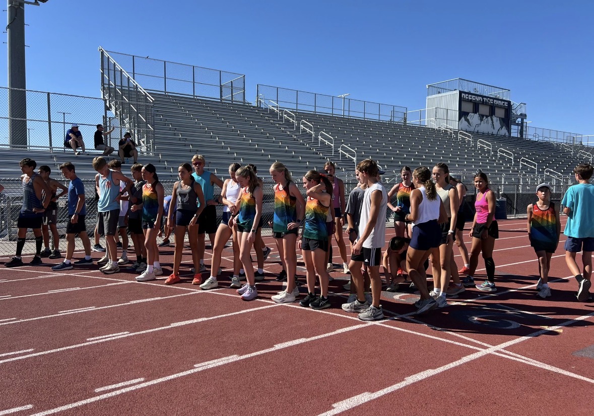 Australians and Shadow kids running on the track