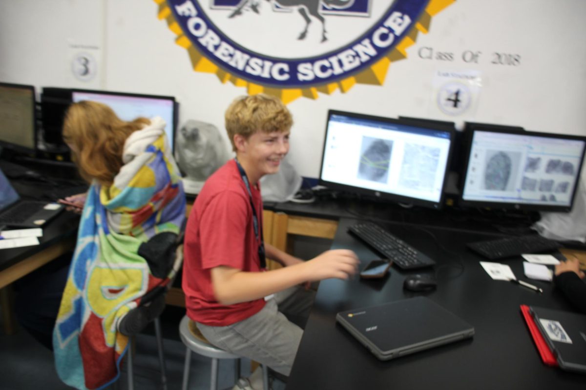 A student laughing in Forensics science