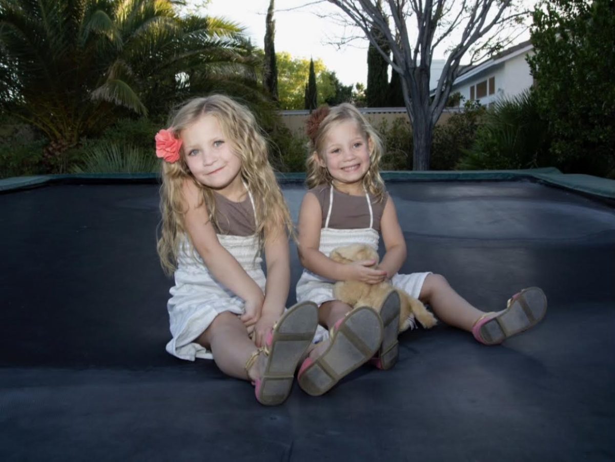 Camden and Emma Finlinson as kids, wearing matching outfits.  