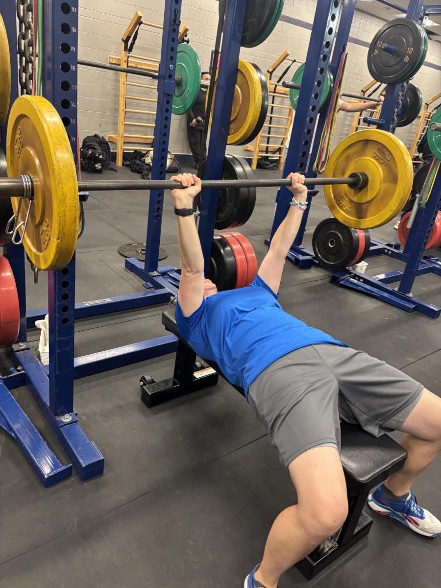 Coach Mac lifting weights.