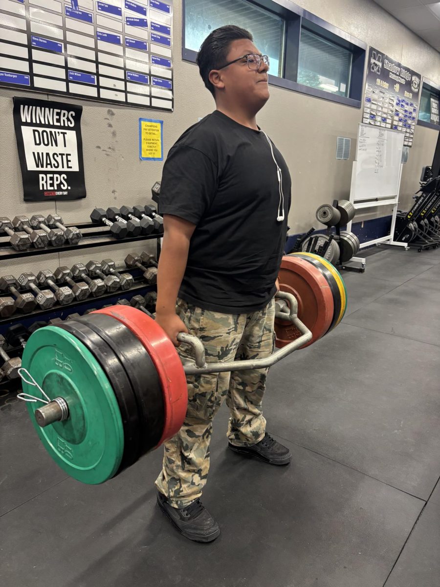 Coach Mac lifting weights.