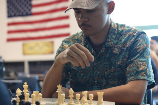 Chess Club member focusing