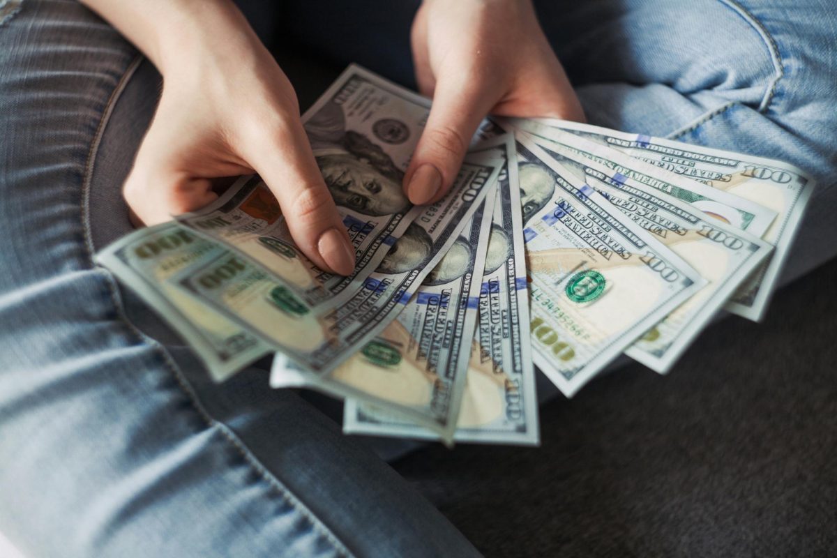 Multiple $100 bills being spread