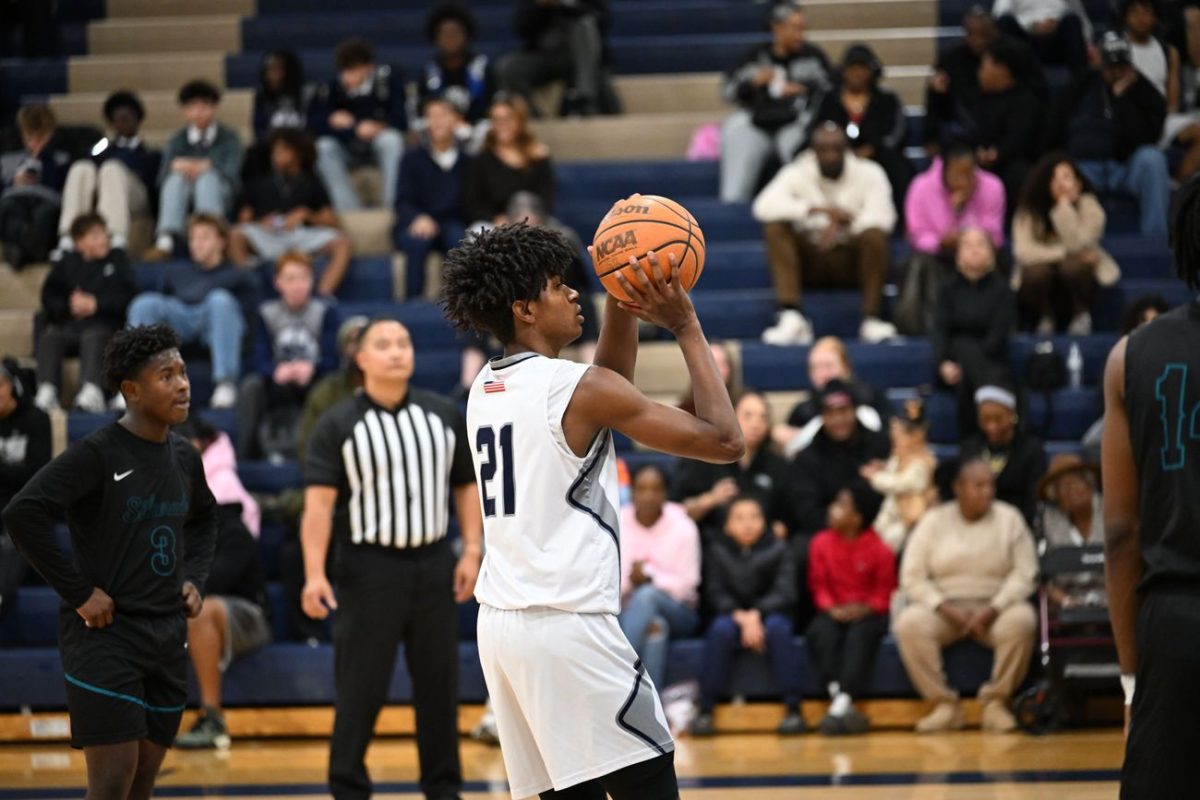 Jaden Williams going for a 3 point Jump shot