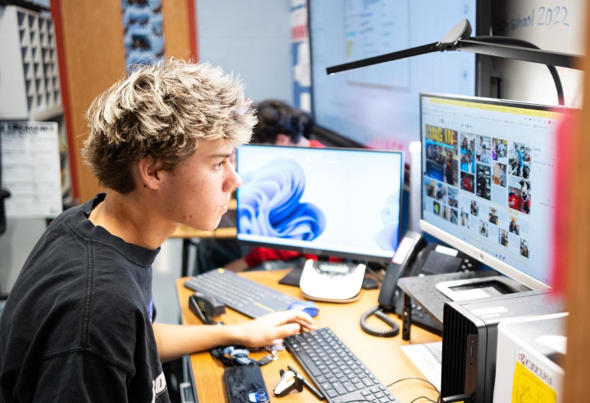 Student working hard on the yearbook.