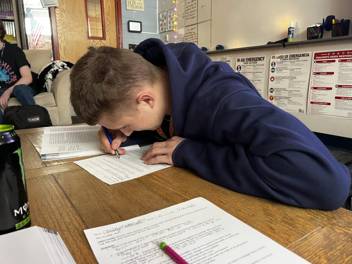 A student finishing work in class.