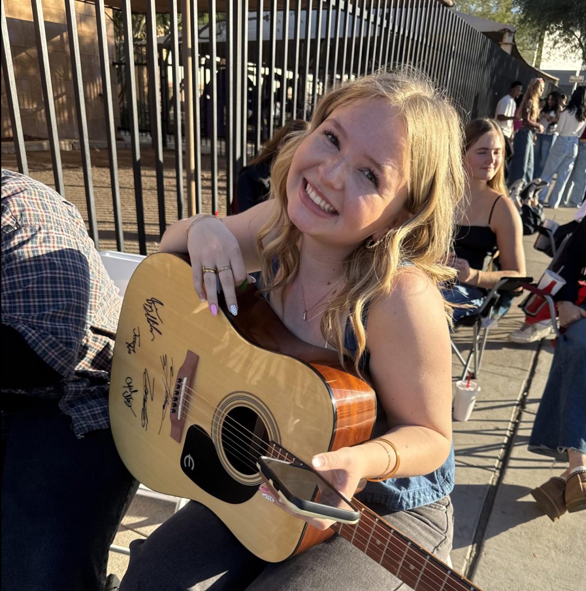 Allison at concert with guitar