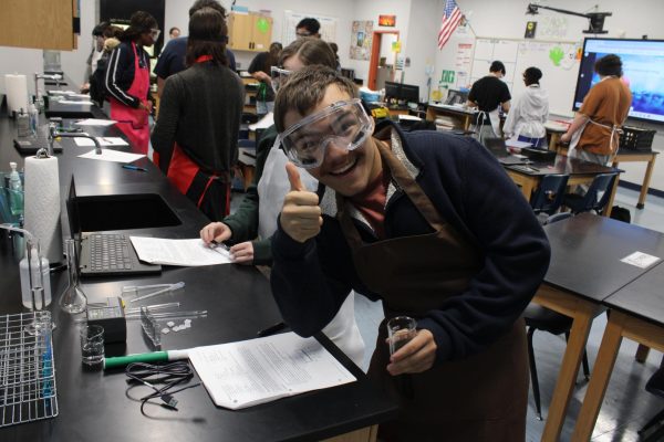 Student in AP Biology doing a lab.