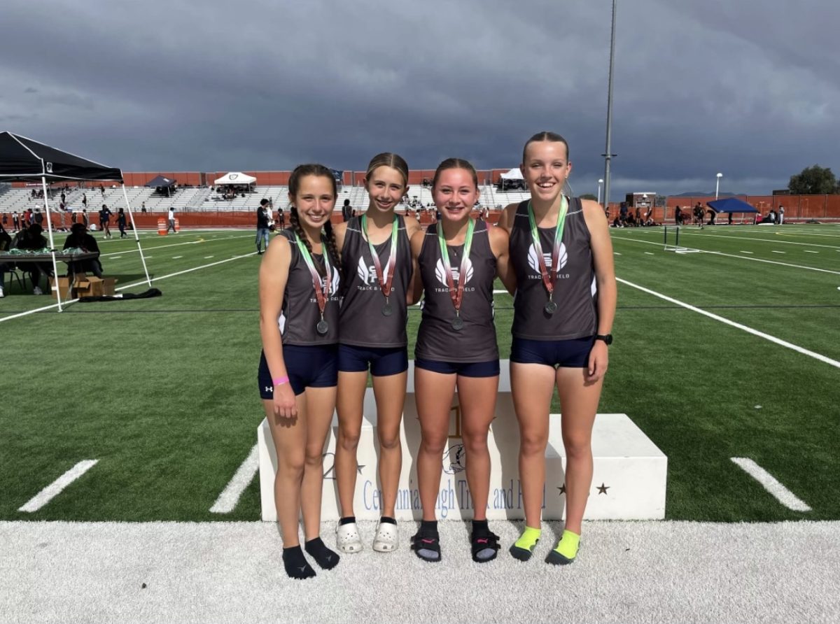 Chesnie Hoge with her teammates after they won their race their freshman year