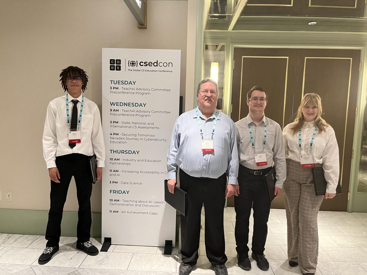 Students and Mr.Mann after winning a cybersecurity competition