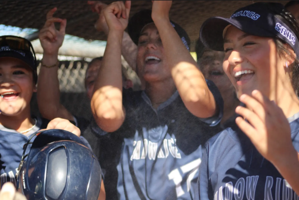 Softball cheering during a game