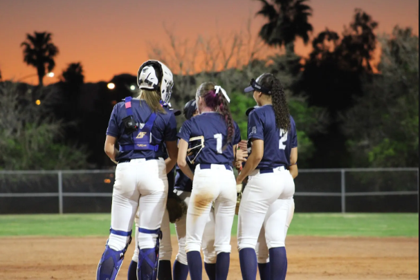 Softball talking about the game plan