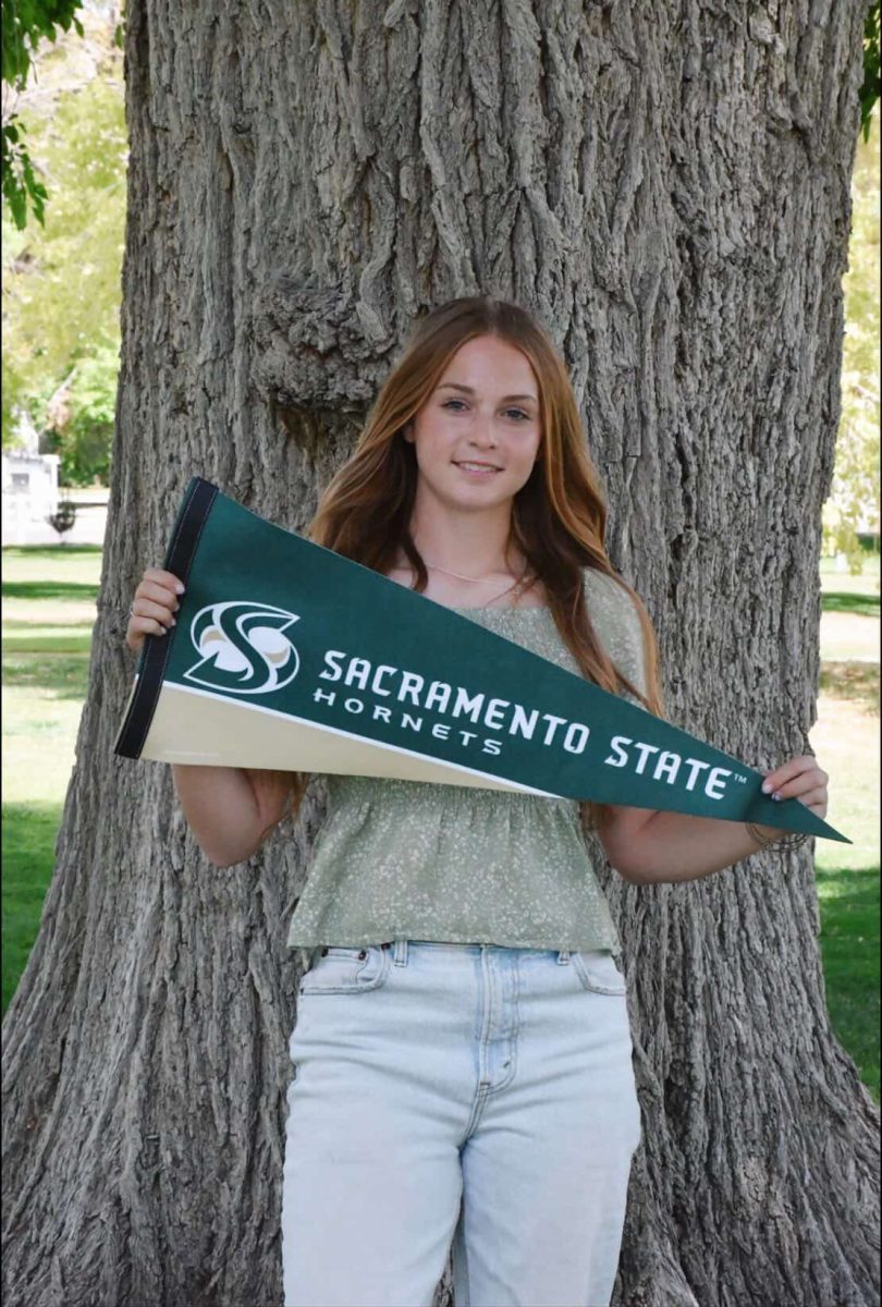 Harmony with her commitment flag from Sacramento State.