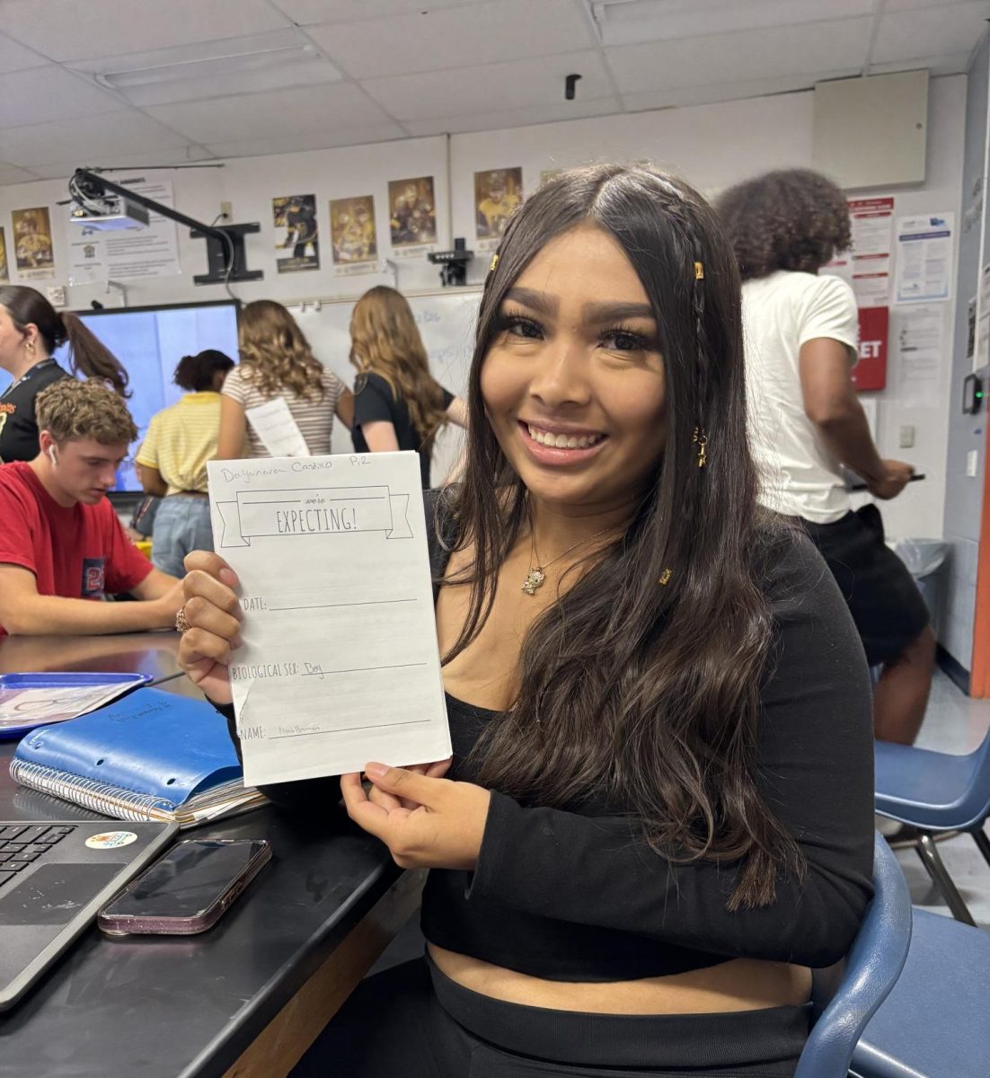 Student with her pregnancy journal.